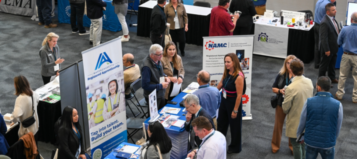people at an expo exploring the exhibit tables